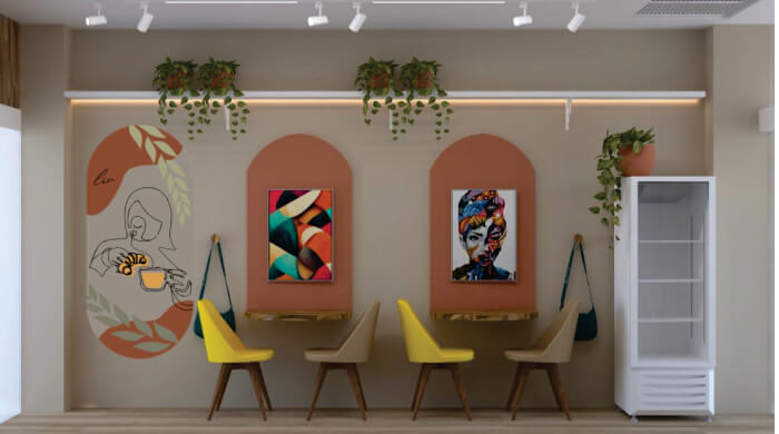 Espaço com cadeiras amarelas, plantas e quadros coloridos